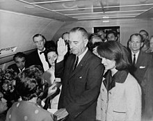 https://upload.wikimedia.org/wikipedia/commons/thumb/c/cc/Lyndon_B._Johnson_taking_the_oath_of_office%2C_November_1963.jpg/220px-Lyndon_B._Johnson_taking_the_oath_of_office%2C_November_1963.jpg